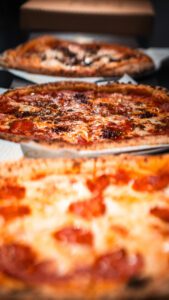 Some mouth watering pizza just out of the oven. 