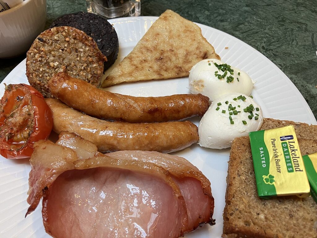 A full Irish breakfast with boxty, black and white pudding, bacon, sausages and poached eggs