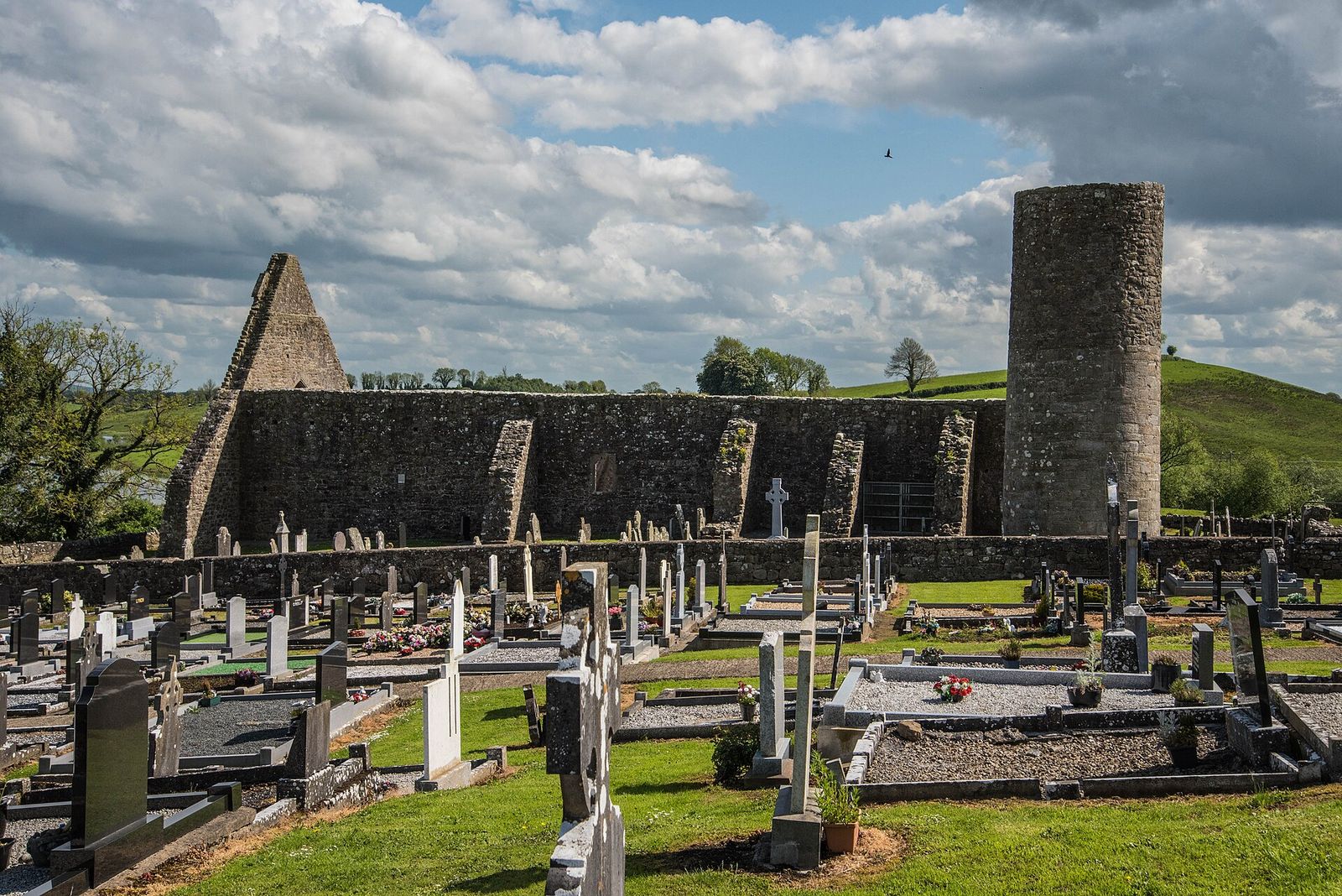 Round tower and roofless abbey at Drumlane, County Cavan